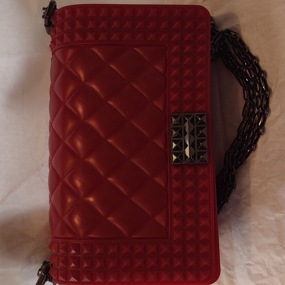 Beautiful burgundy rubber purse beautiful hardware. Great condition.
